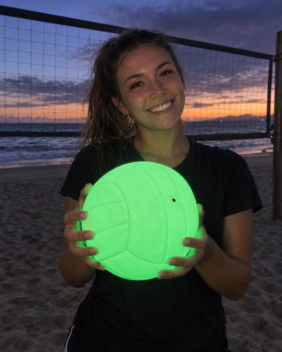 Volley Glow volleyball glowing green at night